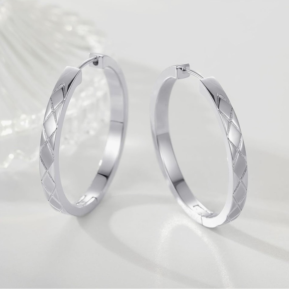 Silver hoop earrings, box included.